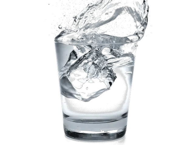 A glass of clear water in mid-splash